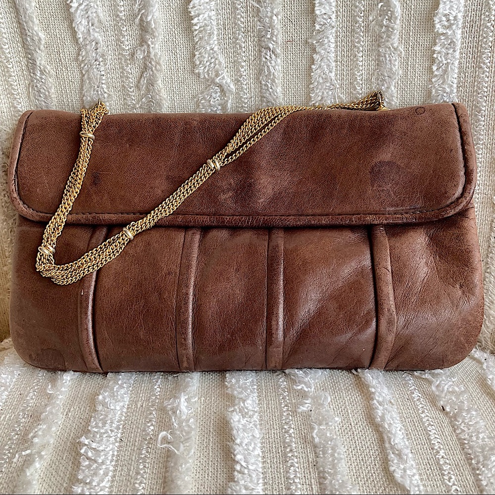 Elegant vintage soft brown leather clutch bag with chain handle